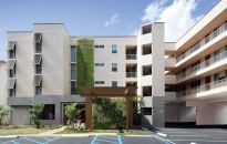 Vitus Group is preserving the long-term affordability of the 55-unit Banyan Street Manor in Honolulu. An acquired public housing property, the development has undergone an extensive renovation, including the addition of solar panels and a vertical green wall to cool the building.