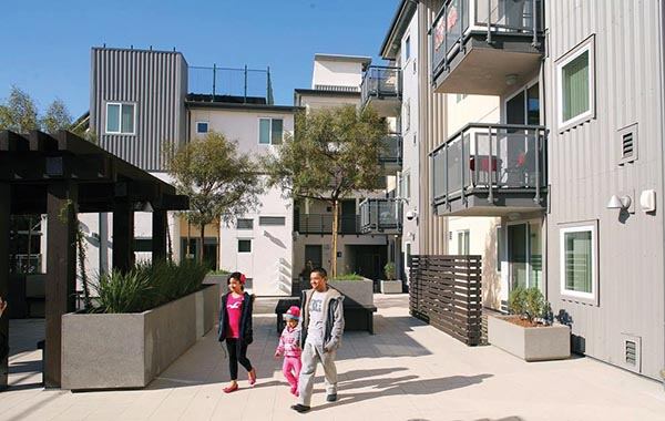 Green features at Rio Vista Apartments include reclaimed water irrigation, solar water heating, and a rooftop garden.