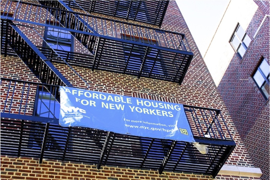 Development and finance partners celebrated the completion of the 72-unit building at 552 Academy Street in Inwood in mid-April.