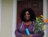 Resident Johnnie George celebrates at the ribbon-cutting ceremony for Robin Lane Apartments.