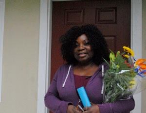 Resident Johnnie George celebrates at the ribbon-cutting ceremony for Robin Lane Apartments.