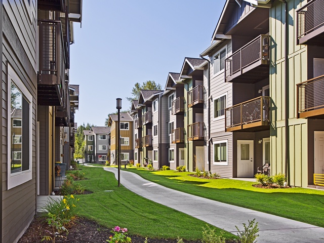 In all the units, metal balconies and public spaces face away from the parking areas.