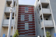 Designed by Michael Willis Architects, Acts Cyrene Apartments has a mix of one-, two-, and three-bedroom units that serve residents earning 30% to 50% of the area median income. Fourteen units have been reserved for individuals who were homeless or at risk of homelessness.