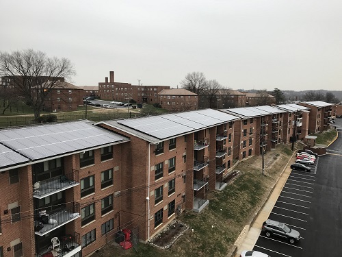WinnCompanies installed a 651-kilowatt renewable energy facility on the roofs of Atlantic Terrace Apartments in Washington, D.C. Officials say the effort is the largest community solar project in the District.