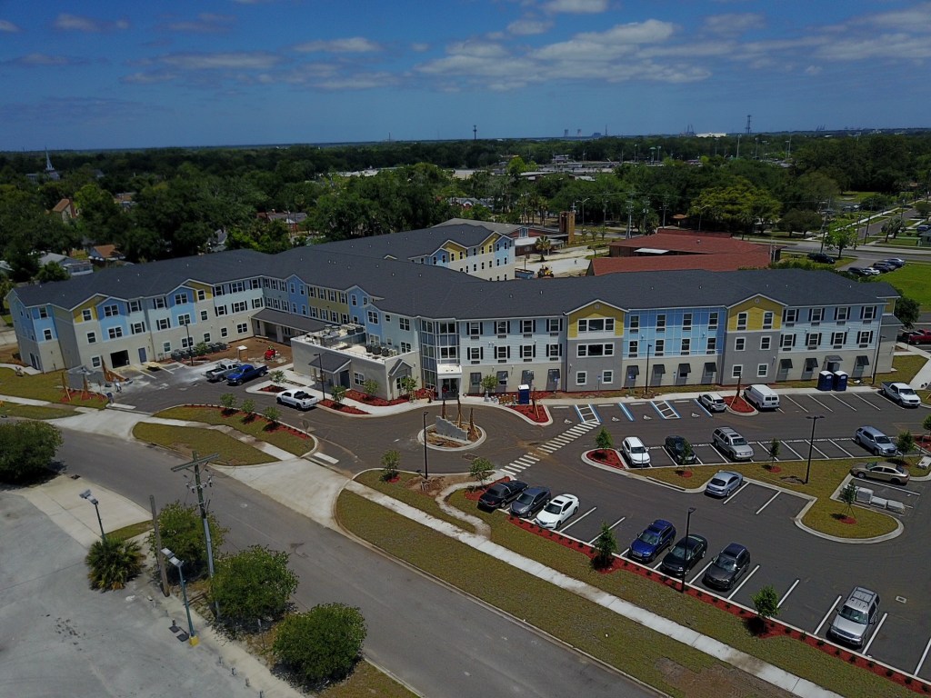 Developed by Sulzbacher Center and Vestcor Cos., Sulzbacher Village offers 70 apartments for women and families that earn up to 33% and 60% of the area median income and a health center in Jacksonville, Fla.