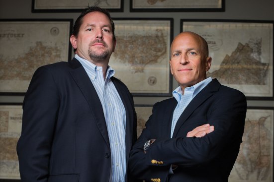Affordable housing developer The Woda Group and its affiliates have reorganized as Woda Cooper Cos. The company will continue to be overseen by managing directors Jeffrey Woda (left) and David Cooper Jr.