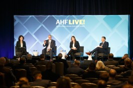 From left, Emily Cadik of the Affordable Housing Tax Credit Coalition, David Gasson of the Housing Advisory Group/Boston Capital, Shannon Ross of the Housing Partnership Network, and Jeff Whiting of CREA break down the latest federal news at AHF Live in Chicago in mid-November.
