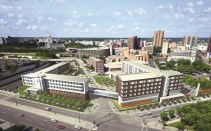 A skyway connects the new Dorothy Day Place building (right) with the first-phase building.