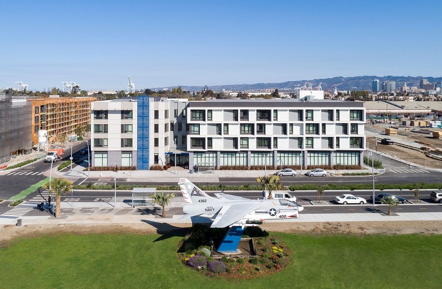 Corsair Flats, a 60-unit affordable housing community for seniors and veterans, has opened its doors at the former Naval Air Station Alameda in Alameda, California. The property’s name is inspired by U.S. Navy Vought F4U Corsair airplane on display nearby.