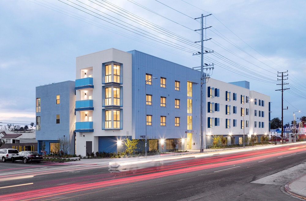 In addition to 33 affordable homes, Metro @ Western features outdoor lounge areas, a large community room with a kitchen, and a play structure.