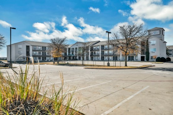 An extended-stay hotel has been adapted into permanent affordable housing for individuals who were homeless and others in Fort Worth, Texas.