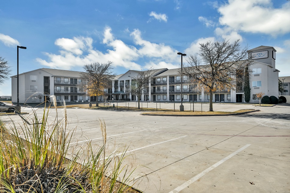 An extended-stay hotel has been adapted into permanent affordable housing for individuals who were homeless and others in Fort Worth, Texas.