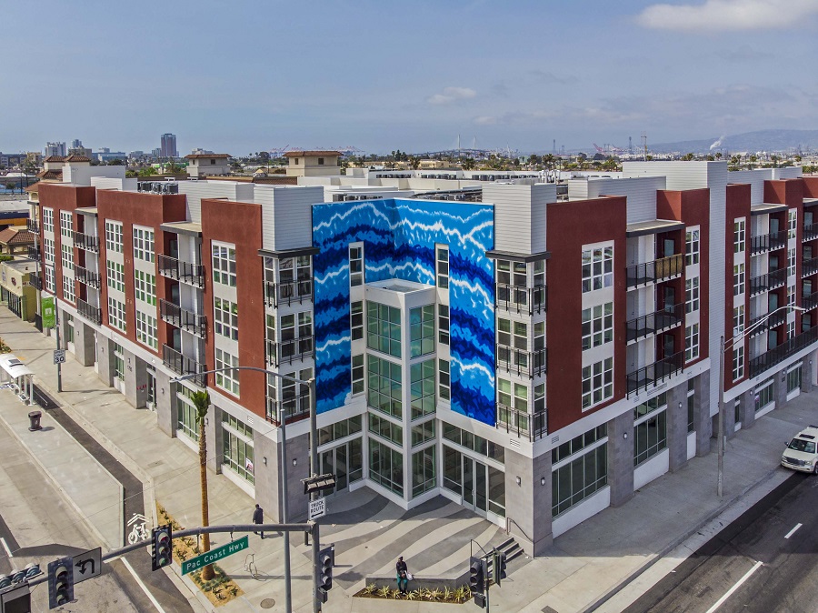 With a dramatic three-story blue tile mural echoing the waves of the nearby seaside, Las Ventanas provides needed affordable housing in Long Beach, California. The 102-unit project is the latest development completed by AMCAL Multi-Housing.
