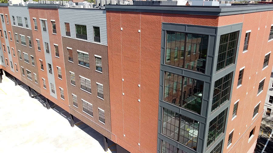 Mill Street Square utilizes both new construction and the reuse of a historic mill to bring 74 affordable homes to Paterson, New Jersey.