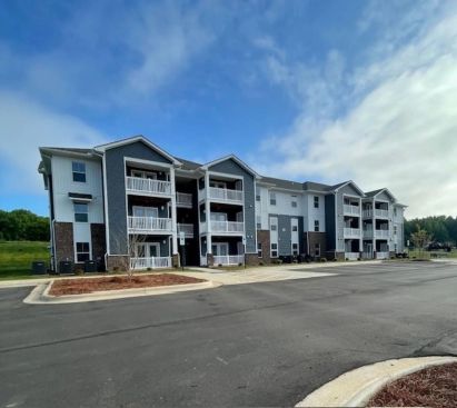 Oak View includes a playground, landscaped grounds, green space, a community center, and on-site parking.