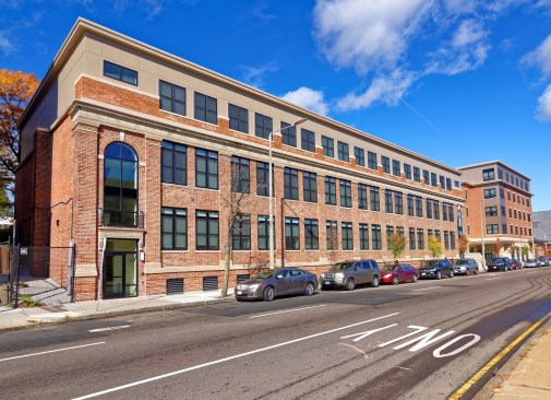 The Boston area is seeing many of its parishes close, merge, or form collaboratives as demographics change. After the St. Kevin's Parish closed, the Planning Office for Urban Affairs, the nonprofit developer associated with the Roman Catholic Archdiocese of Boston, worked to transform the 2.7-acre site. The development team completed an adaptive reuse of the former St. Kevin's Parish school and church building, which added a third floor to the building, and constructed two new buildings.