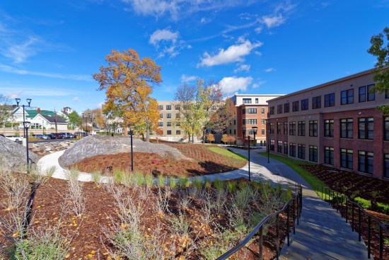 The LEED Silver development features interior bike storage, a computer room, a fitness center, and a cafe and a lounge area. 