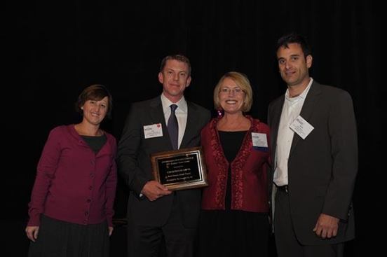 The best historic rehab honor goes to Courthouse Lofts in Kansas City, Mo., developed by The Alexander Co. Pictured are (from left) Affordable Housing Finance Executive Editor Christine Serlin; Joe Alexander, president of The Alexander Co.; Lynn Craghead, business development officer with U.S. Bancorp Community Development Corp.; and Matt Meier, vice president of real estate development for The Alexander Co.