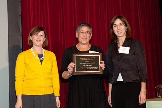 The honor for top urban development goes to The Homes at Old Colony in South Boston, Mass., developed by Beacon Communities Development, LLC, in partnership with the Boston Housing Authority. Accepting the award from Affordable Housing Finance Executive Editor Christine Serlin are Pamela Goodman (center), president of Beacon, and Darcy Jameson (right), project director.