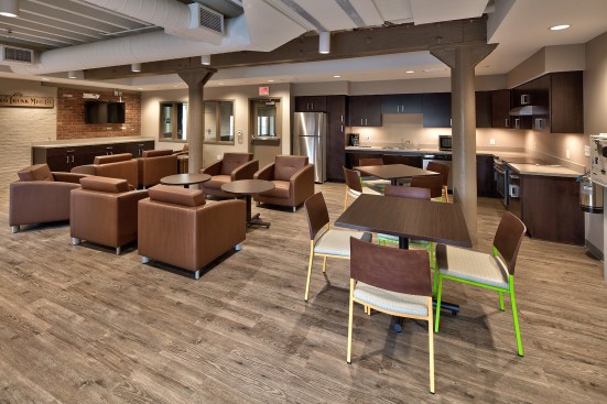 A new lobby and community room inside and a new main entrance complete with new signage, exterior canopies, and a private courtyard complete the building's aesthetic.