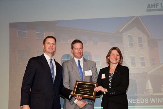 The best special-needs development is The Commons at Livingston in Columbus, Ohio, developed by National Church Residences. Pictured are Michelle Norris, senior vice president and chief development officer at National Church Residences; Sean Thomas (center) from the Ohio Housing Finance Agency; and David Leopold, senior vice president of Bank of America Merrill Lynch.