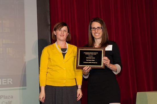 The winner of the seniors category is Fair Oaks Plaza in Sunnyvale, Calif., developed by MidPen Housing Corp. Abby Goldware (right), a project manager at MidPen Housing, accepts the award from Affordable Housing Finance Executive Editor Christine Serlin.