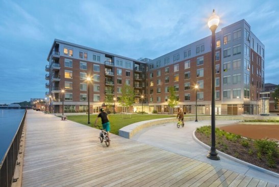 With approximately 269,000 square feet of total developed space, Harbor Place includes 80 units of mixed-income housing featuring six different income tiers; 65,500 square feet of office/educational/cultural/commercial space; an underground parking garage with a new public plaza built on top; and a new boardwalk that brings residents to the Merrimack River in this section of downtown Haverhill for the first time in over 80 years. 