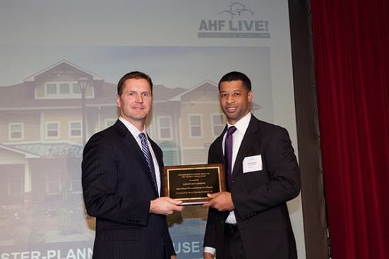 Savannah Gardens in Savannah, Ga., developed by Mercy Housing Southeast, Inc., is the winner of the master-planned/mixed-use category. Pictured are Kris Bryant (right), project developer for Mercy Housing Southeast, and David Leopold, senior vice president of Bank of America Merrill Lynch.