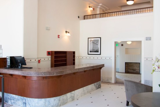 Elements of the interior renovation pay homage to Hotel Churchill’s past. The original wood and marble lobby desk was restored, as was a key slot cabinet. Hexagon-shaped tile flooring was replicated in the lobby.