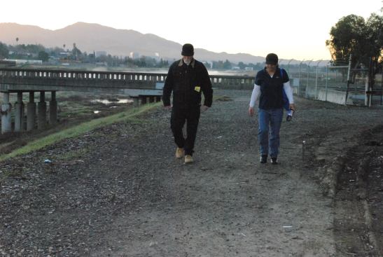 Dudley Luckett, team outreach leader for Project Hope, and Shayne Kaleo, regional director for Anka Behavioral Health, make their way to meet a homeless man during the homeless count in Concord, Calif.