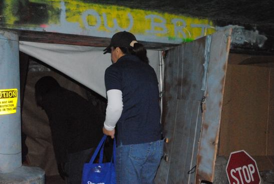 Shayne Kaleo steps inside a homeless couple’s shelter.