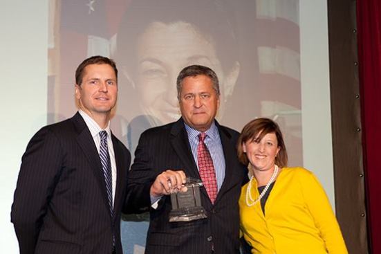 Bob Moss (center), senior vice president of Boston Capital, accepts Sen. Olympia Snowe’s award on her behalf from Christine Serlin, executive editor of Affordable Housing Finance, and David Leopold, senior vice president of Bank of America Merrill Lynch.