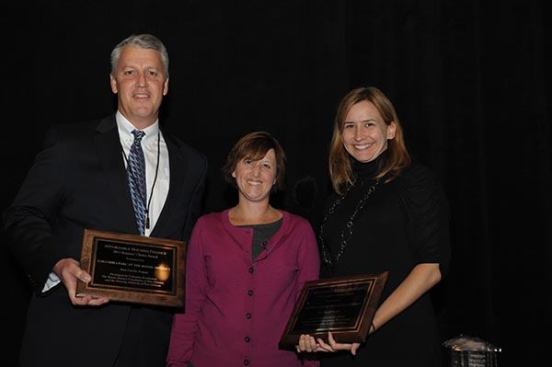 Accepting the awards for Columbia Parc are Jim Grauley, COO of Columbia Residential, and Robin Keegan of the Housing Authority of New Orleans.