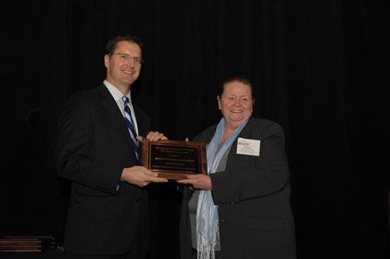 Two developments tied for the honor of best green development. The first winner is Branch of Hope Apartments in Chicago, which was developed by Interfaith Housing Development Corporation of Chicago. Gladys Jordan, president of Interfaith Housing Development Corporation of Chicago, accepts the award from David Leopold, senior vice president of Bank of America Merrill Lynch.