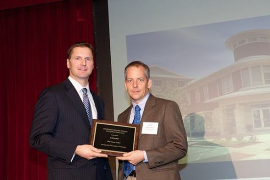 The winner in the green category is M Station in Austin, Texas, which was developed by Foundation Communities. Pictured are Walter Moreau (right), executive director of Foundation Communities, and David Leopold, senior vice president of Bank of America Merrill Lynch.