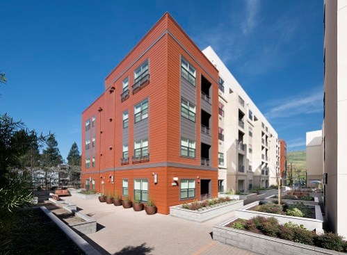 The Alta Mira communities share a 10,000-square-foot courtyard with a playground, gardens, and picnic tables. Each building has a large community room, a computer center, and a fitness center. The five-story buildings sit on top of a below-grade one-level parking garage.