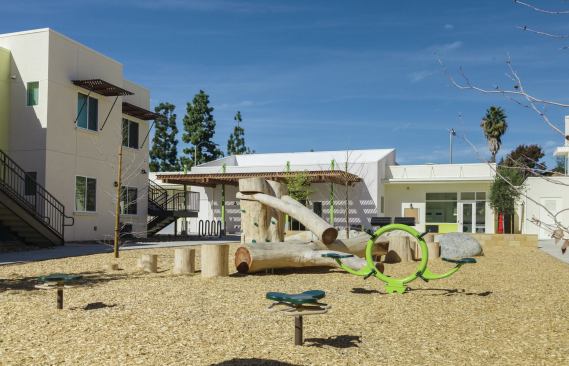 The development has been designed to accommodate the needs of families, including larger units, outdoor picnic tables and barbecues, walking paths, and innovative and structurally artistic play equipment.