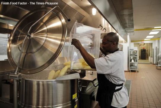 The 13,317-square-foot Centennial Cotton Press Building provides space for Fresh Food Factor, a program of Volunteers of America Greater New Orleans. Launched in 2013, Fresh Food Factor prepares and delivers nutritious means for public and charter schools in New Orleans. It also includes a culinary arts training program.