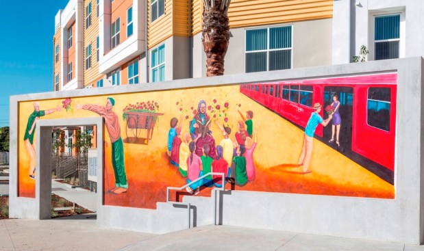 COMM22 displays a variety of art forms for residents and the community. A 30-foot mural entitled "Flowers for My Loved Ones" by master muralist Mario Chacon and his assistant, Hector Villegas, is one of the four art pieces in the master plan. A 16-foot-tall metal and stone sculpture, engraved sidewalk pavers with inspirational messages, and metal benches featuring additional art elements also are part of the community space.