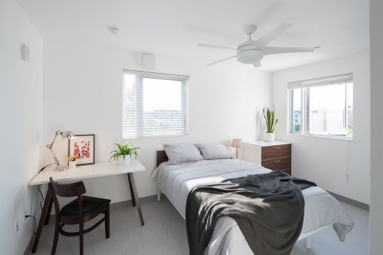Crest Apartments is LEED Platinum certified and features solar thermal panels, low-flow plumbing fixtures, Energy Star appliances, and a rainwater filtration system that harnesses all stormwater on-site. The building's unique form also results in inviting and light-filled apartments.
