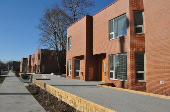 The Rebuild Foundation and Brinshore Development partnered to transform an abandoned public housing development into 32 mixed-income rentals and a new arts center. During the rehabilitation, the development team took four of the two-story townhomes and turned them on their sides to create flats, which included two ground-floor, handicapped-accessible units. 