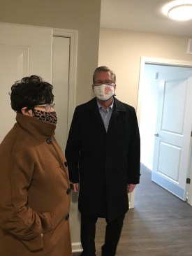 Debi Durham, executive director of the Iowa Finance Authority, and Brad Hart, mayor of Cedar Rapids, Iowa, are part of a small group to preview the Anderson Greene apartments.