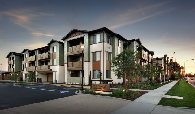 The new development replaces underutilized parcels with a three-story garden-style building situated around a central courtyard.  The building features 17 one-bedroom, 32 two-bedroom, and 21 three-bedroom apartment homes for families earning between 30% and 50% of the area median income.