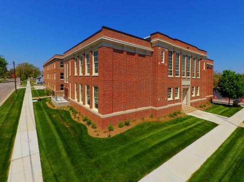 At Lincoln House, 28 new affordable apartment homes were adapted within a restored 1915 brick school and large addition in Owosso, Mich.