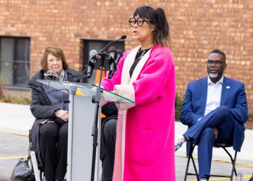 Lisa Yun Lee, executive director, speaks at the opening of the National Public Housing Museum.