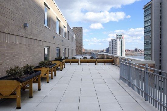 The East Harlem development features outdoor seating and garden space for residents.