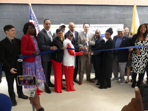 Mayor André Sayegh leads the ribbon-cutting ceremony to open Mill Street Square.