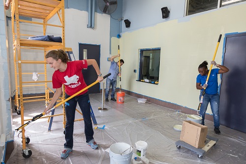 New Hope Housing staff and volunteers work to turn a vacant building into temporary housing for residents displaced by Hurricane Harvey.