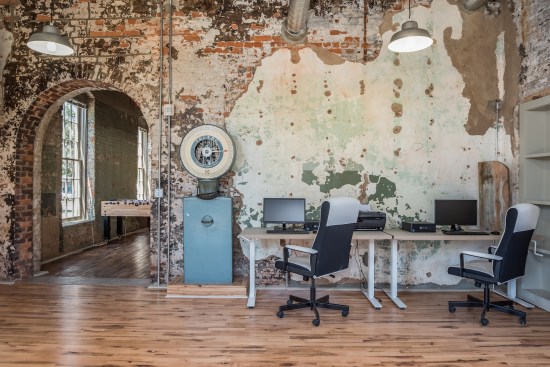 The development team is preserving the history of the mill by leaving patina on the walls and showcasing artifacts in the common areas as art.