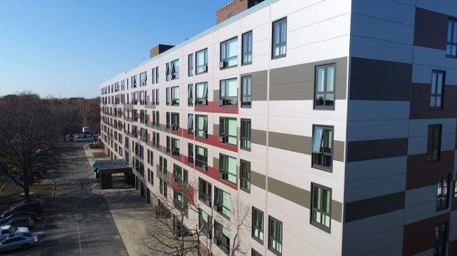 Developers replaced an aging brick facade with energy-efficient metallic paneling.